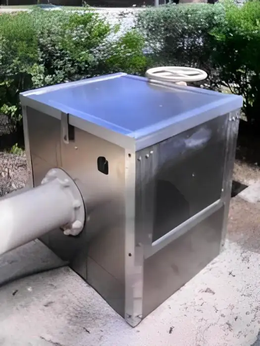 Aluminum enclosure over a backflow preventer with its valve wheel on top