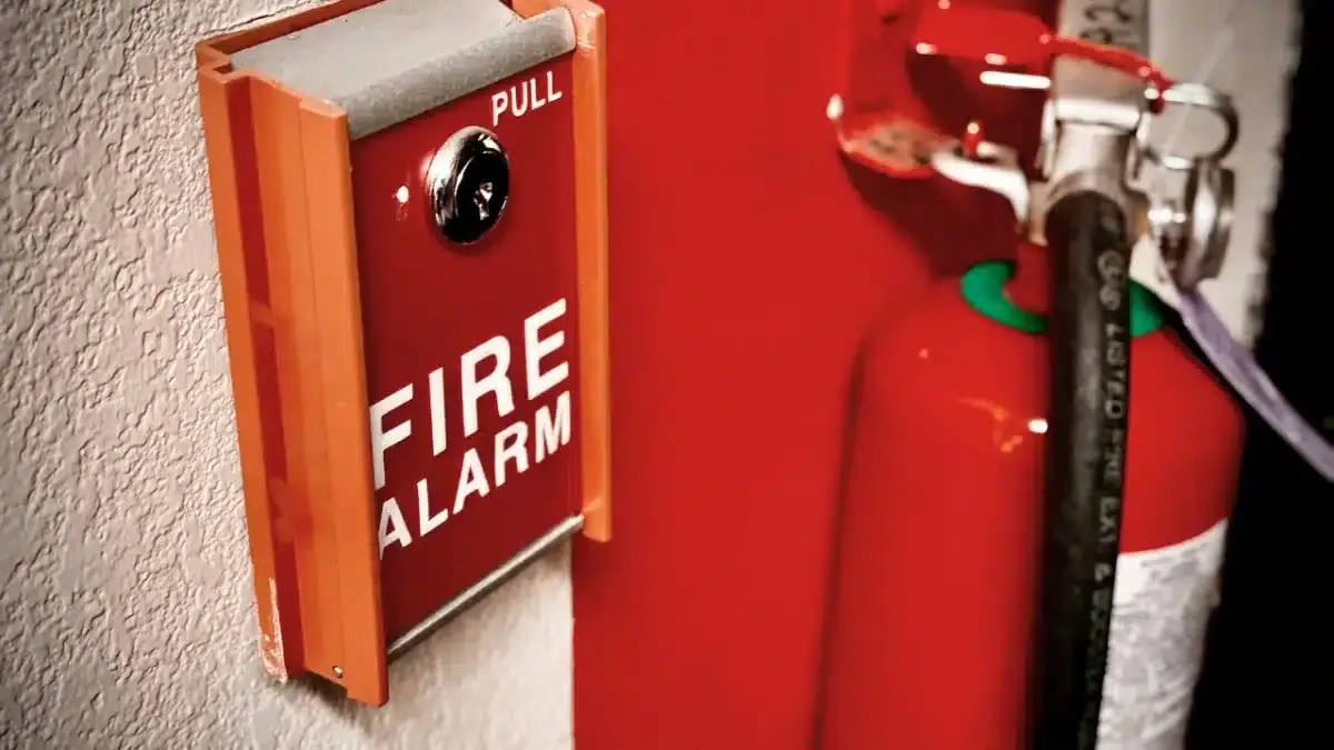 a manual fire alarm pull station and a fire extinguisher